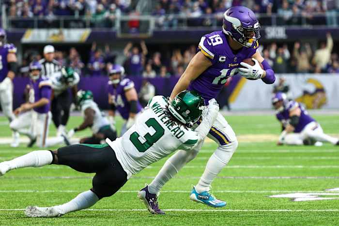 Jets safety Jordan Whitehead attempts to tackle WR Adam Thielen in a 2022 game